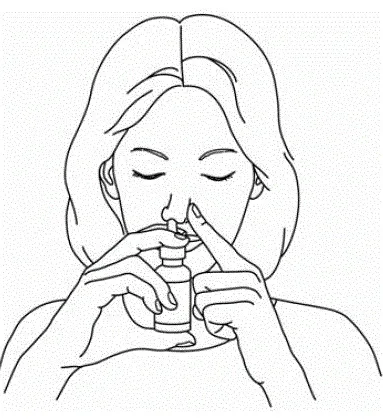 For each spray firmly press the pump 1 time. Keep your head tilted down and at the same time gently breathe in through your nostril - Illustration
