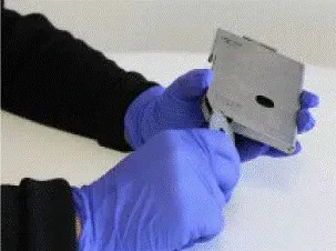 Turn the canister opening tool clockwise to open the bottom of the canister - Illustration