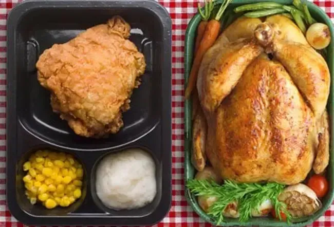 Photo of two chicken dinners.